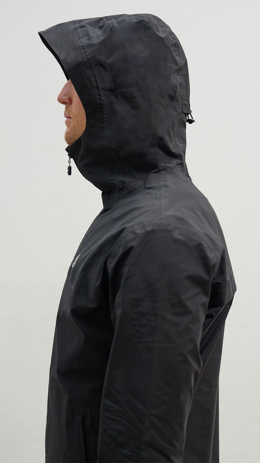 OCL black windbreaker with the hood up, side view